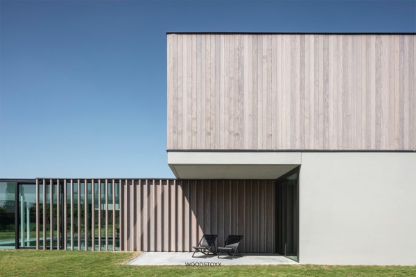 realisation facade cladding in afrormosia wood planchettes and beams